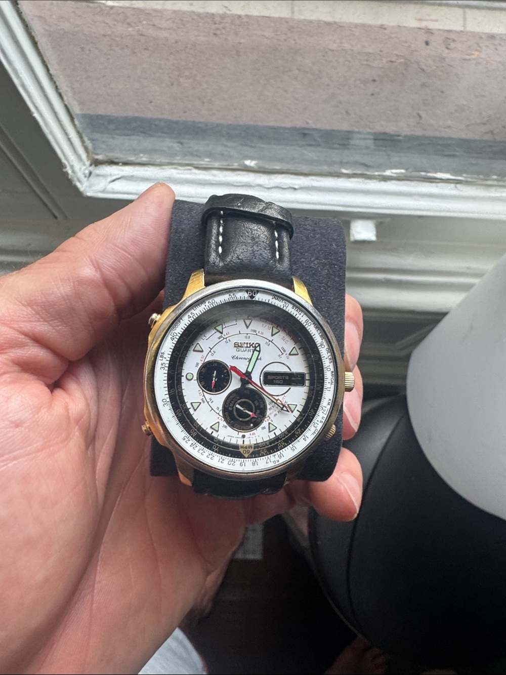 Seiko White Dial Watch with Gold Accents and Black Strap